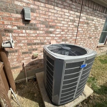 American Standard outdoor condenser unit on a concrete pad