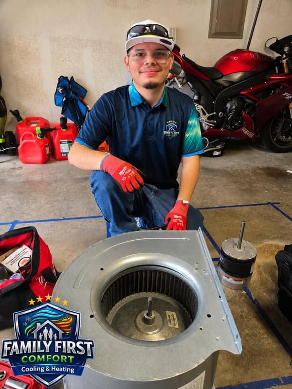 Family First Comfort technician repairing an HVAC blower motor
